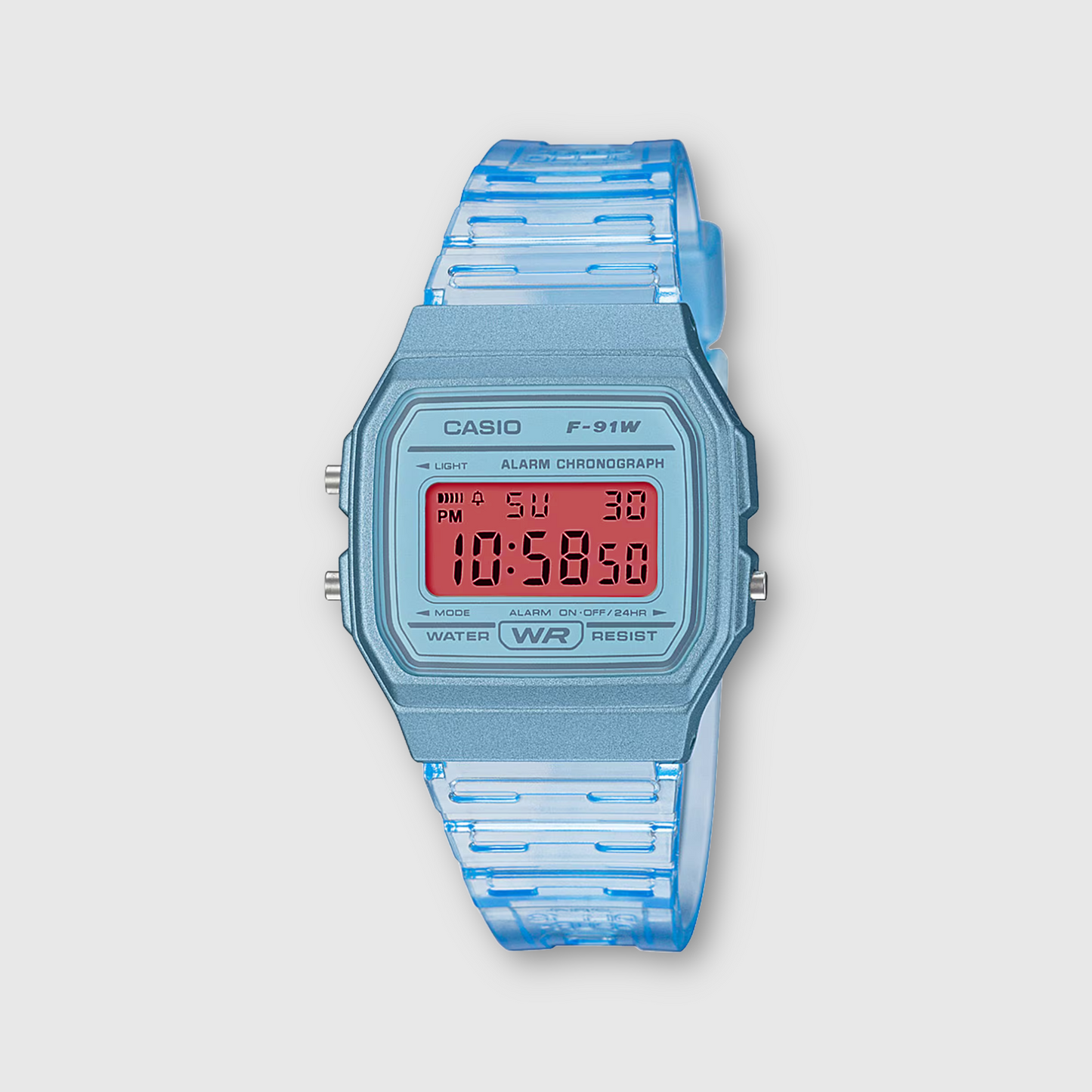 Casio digital watch with blue strap on a light gray background