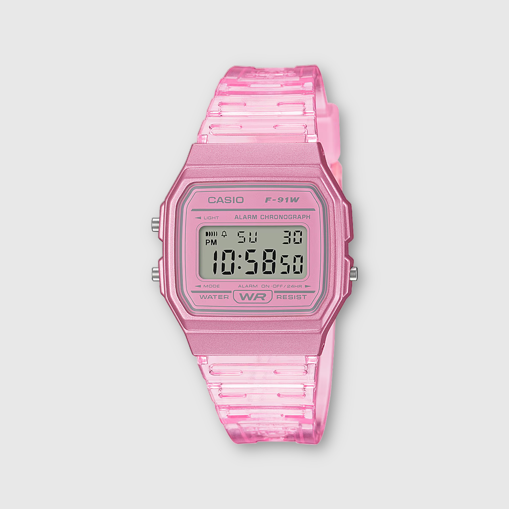 Pink Casio digital watch on a light gray background