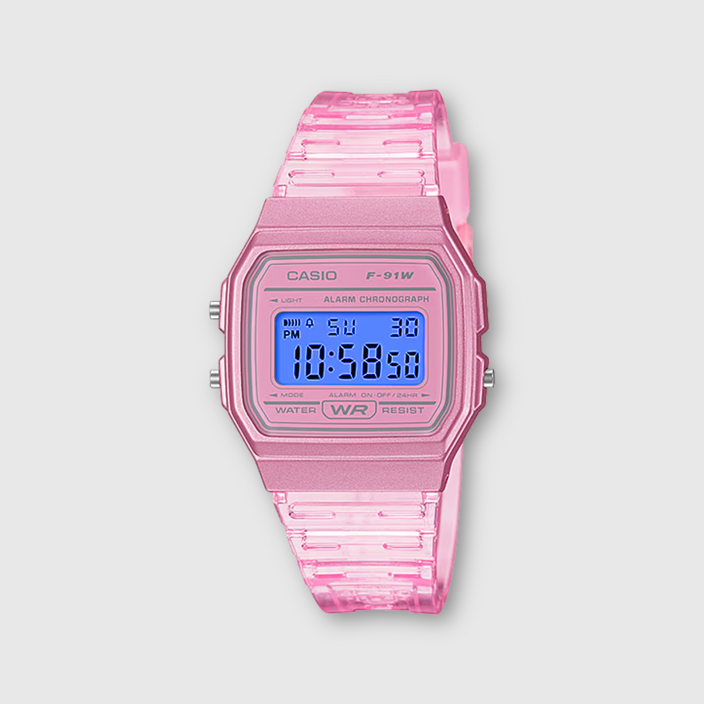 Pink Casio digital watch on a light gray background