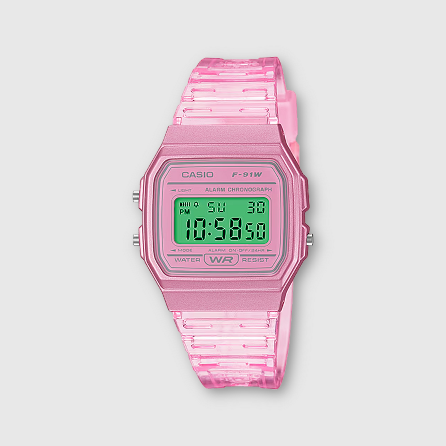 Pink Casio digital watch on a light gray background