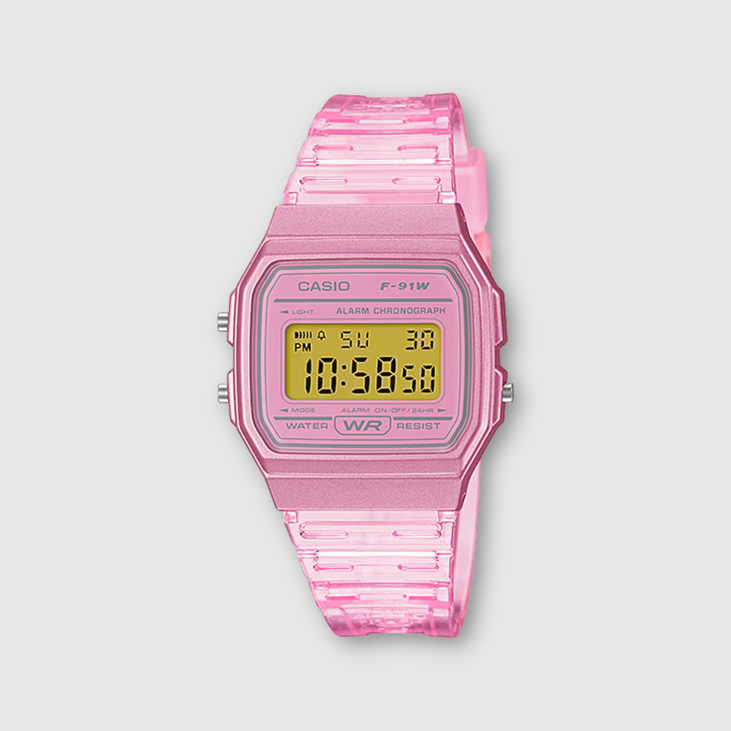 Pink Casio digital watch on a light gray background