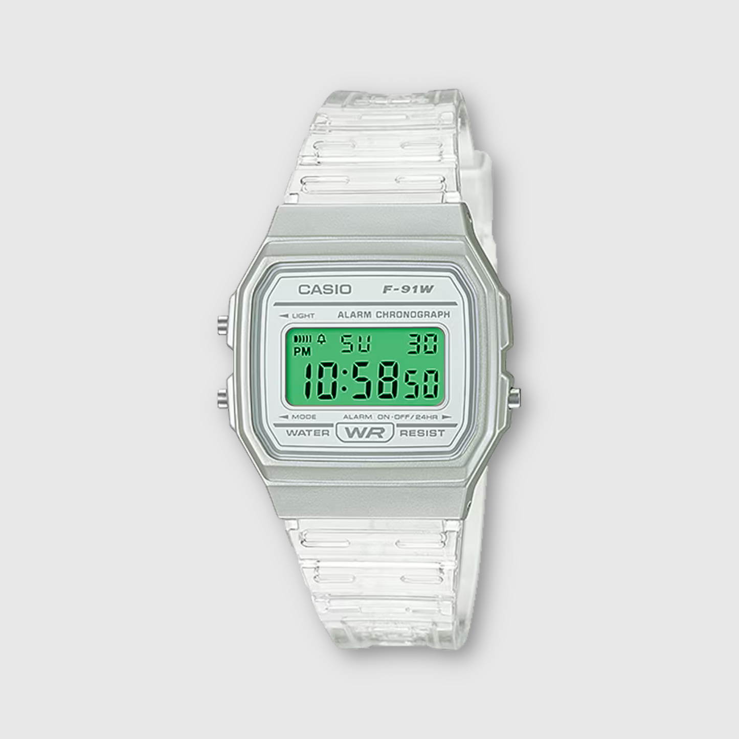 Casio digital watch with clear strap on a light gray background