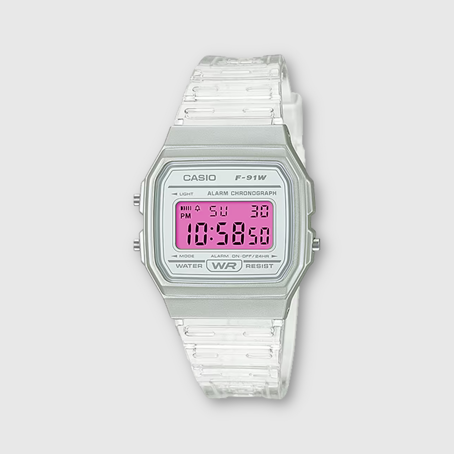 Casio digital watch with pink display on a light gray background