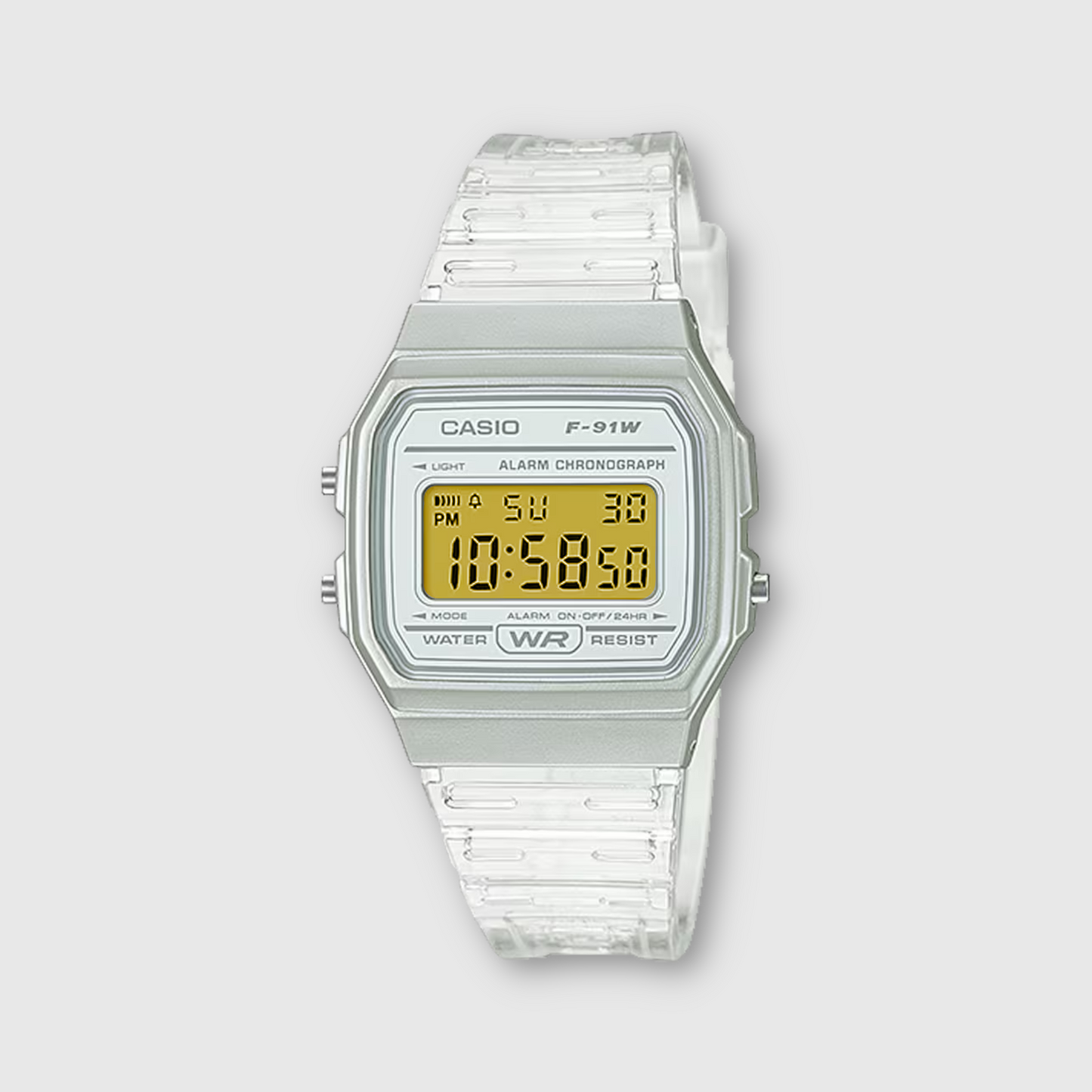 Casio digital watch with clear strap on a light gray background