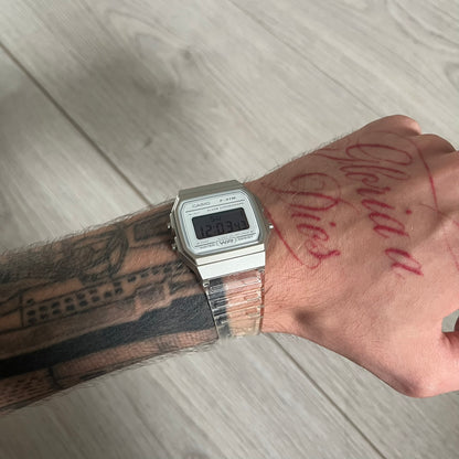 Custom Casio F-91W Clear/Transparent digital watch featuring a Silver reflective filter screen. Slim 8.5 mm profile, lightweight 21 g build and flexible bio-based resin band ensure lasting comfort. Includes alarm, stopwatch, and microlight function for everyday functionality.