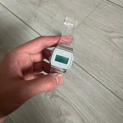 Custom Casio F-91W Clear/Transparent digital watch featuring a Silver reflective filter screen. Slim 8.5 mm profile, lightweight 21 g build and flexible bio-based resin band ensure lasting comfort. Includes alarm, stopwatch, and microlight function for everyday functionality.