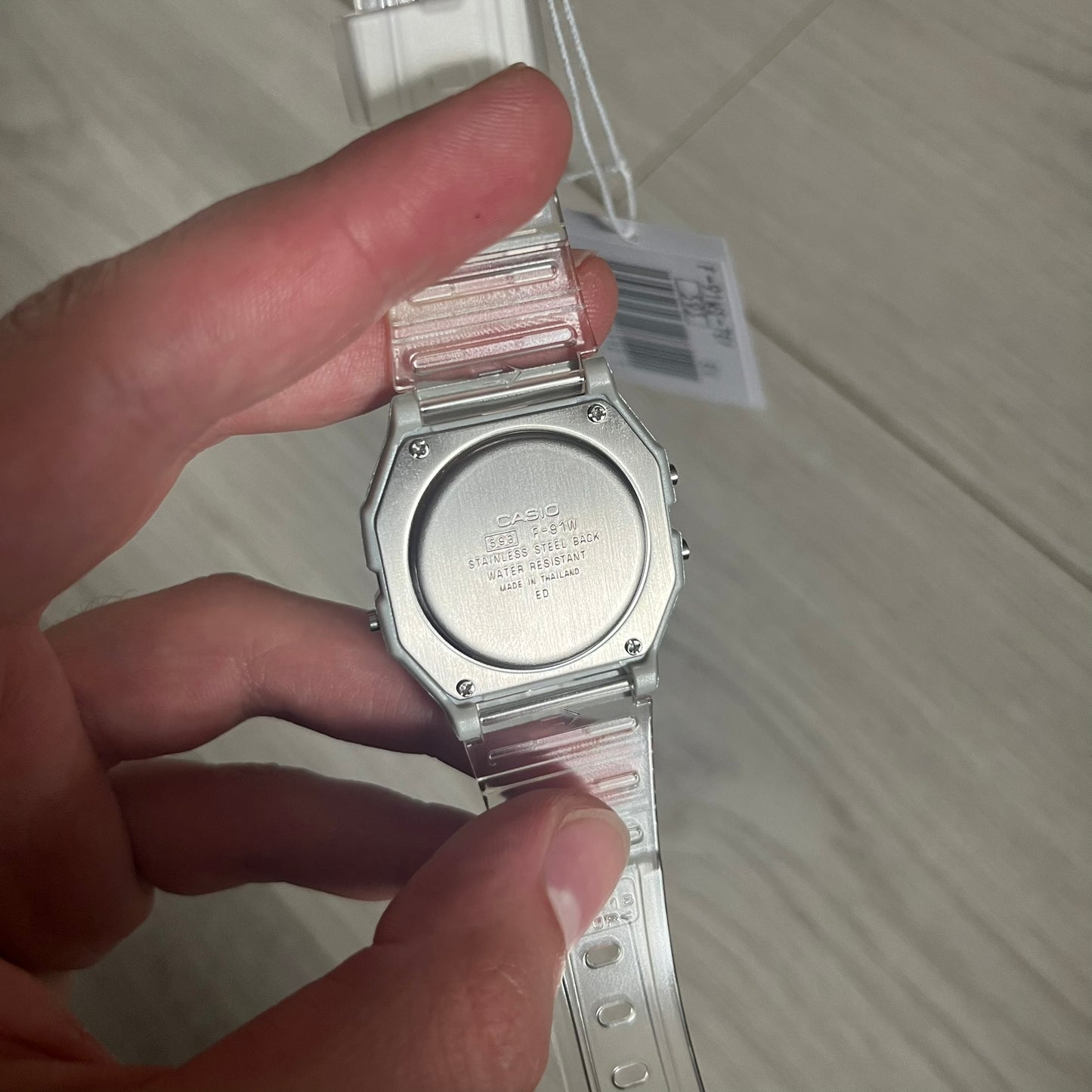 Custom Casio F-91W Clear/Transparent digital watch featuring a Silver reflective filter screen. Slim 8.5 mm profile, lightweight 21 g build and flexible bio-based resin band ensure lasting comfort. Includes alarm, stopwatch, and microlight function for everyday functionality.