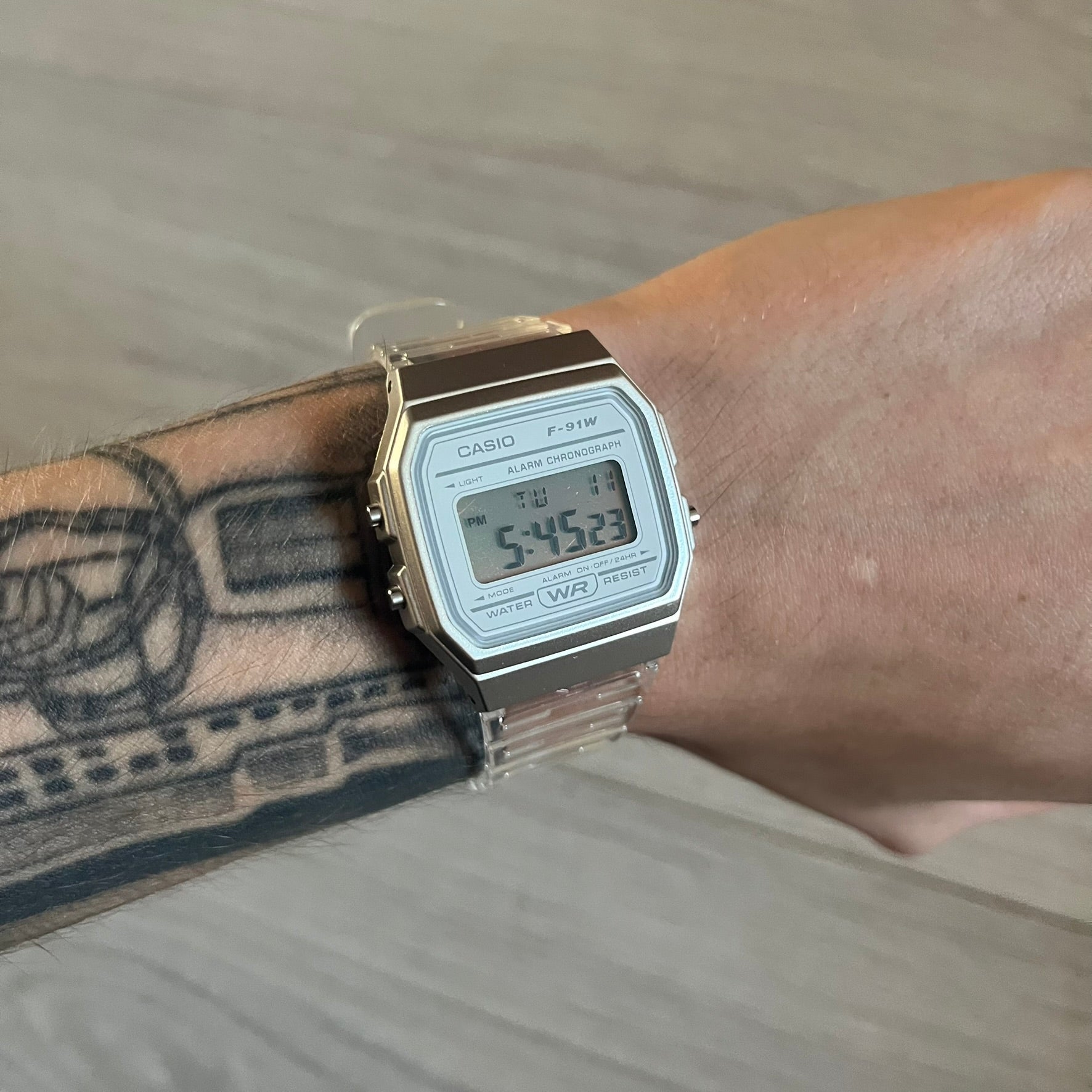 Custom Casio F-91W Clear/Transparent digital watch featuring a Silver reflective filter screen. Slim 8.5 mm profile, lightweight 21 g build and flexible bio-based resin band ensure lasting comfort. Includes alarm, stopwatch, and microlight function for everyday functionality.