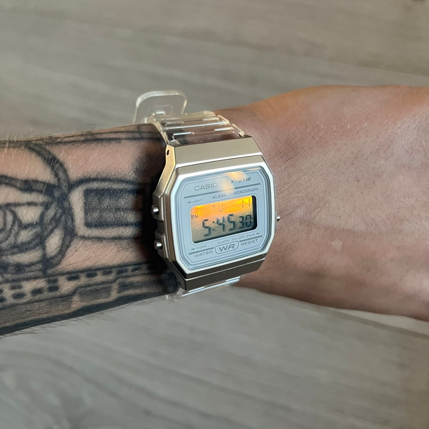 Custom Casio F-91W Clear/Transparent digital watch featuring a Silver reflective filter screen. Slim 8.5 mm profile, lightweight 21 g build and flexible bio-based resin band ensure lasting comfort. Includes alarm, stopwatch, and microlight function for everyday functionality.