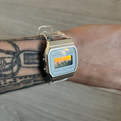 Custom Casio F-91W Clear/Transparent digital watch featuring a Silver reflective filter screen. Slim 8.5 mm profile, lightweight 21 g build and flexible bio-based resin band ensure lasting comfort. Includes alarm, stopwatch, and microlight function for everyday functionality.