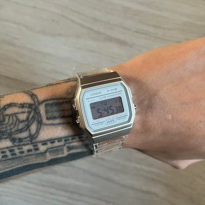 Custom Casio F-91W Clear/Transparent digital watch featuring a Silver reflective filter screen. Slim 8.5 mm profile, lightweight 21 g build and flexible bio-based resin band ensure lasting comfort. Includes alarm, stopwatch, and microlight function for everyday functionality.