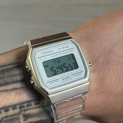 Custom Casio F-91W Clear/Transparent digital watch featuring a Silver reflective filter screen. Slim 8.5 mm profile, lightweight 21 g build and flexible bio-based resin band ensure lasting comfort. Includes alarm, stopwatch, and microlight function for everyday functionality.