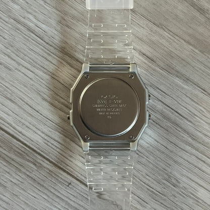Custom Casio F-91W Clear/Transparent digital watch featuring a Silver reflective filter screen. Slim 8.5 mm profile, lightweight 21 g build and flexible bio-based resin band ensure lasting comfort. Includes alarm, stopwatch, and microlight function for everyday functionality.