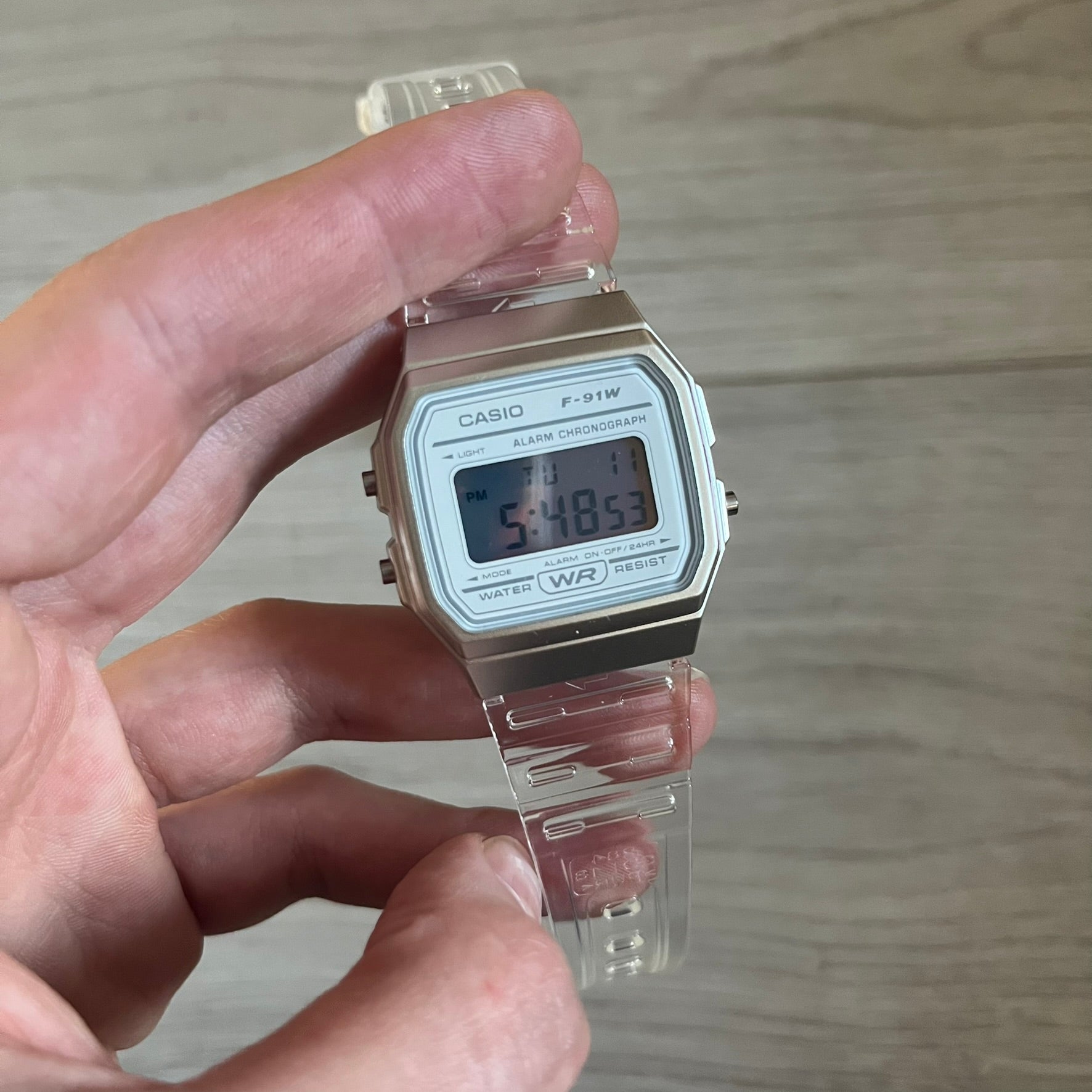 Custom Casio F-91W Clear/Transparent digital watch featuring a Silver reflective filter screen. Slim 8.5 mm profile, lightweight 21 g build and flexible bio-based resin band ensure lasting comfort. Includes alarm, stopwatch, and microlight function for everyday functionality.