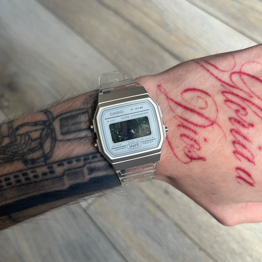Custom Casio F-91W Clear/Transparent digital watch featuring a see through/clear filter screen. Slim 8.5 mm profile, lightweight 21 g build and flexible bio-based resin band ensure lasting comfort. Includes alarm, stopwatch, and microlight function for everyday functionality.