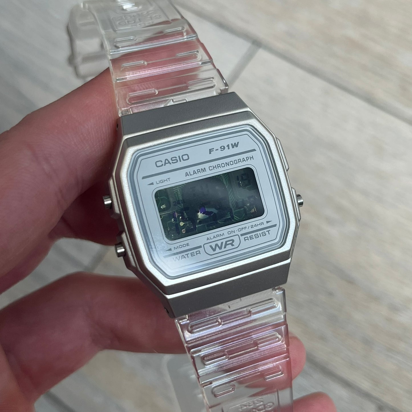 Custom Casio F-91W Clear/Transparent digital watch featuring a see through/clear filter screen. Slim 8.5 mm profile, lightweight 21 g build and flexible bio-based resin band ensure lasting comfort. Includes alarm, stopwatch, and microlight function for everyday functionality.