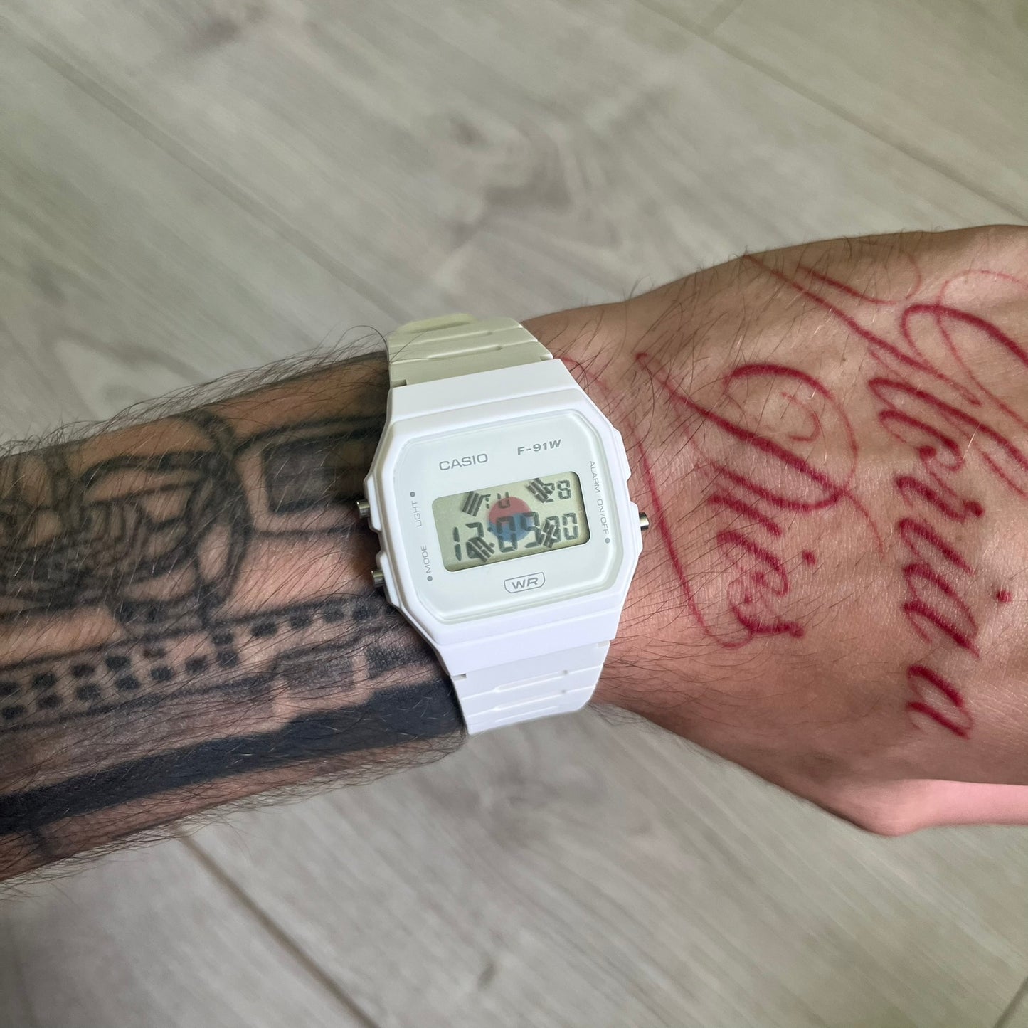 Custom Casio F-91W White digital watch featuring a South Korea flag filter screen. Slim 8.5 mm profile, lightweight 21 g build and flexible bio-based resin band ensure lasting comfort. Includes alarm, stopwatch, and microlight function for everyday functionality.