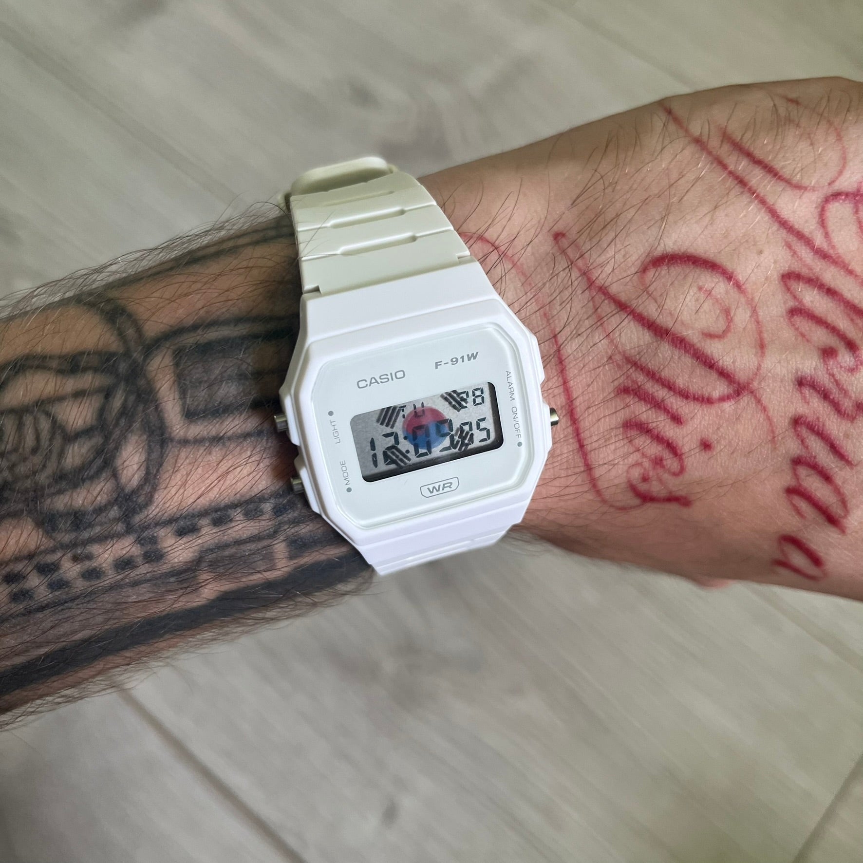 Custom Casio F-91W White digital watch featuring a South Korea flag filter screen. Slim 8.5 mm profile, lightweight 21 g build and flexible bio-based resin band ensure lasting comfort. Includes alarm, stopwatch, and microlight function for everyday functionality.