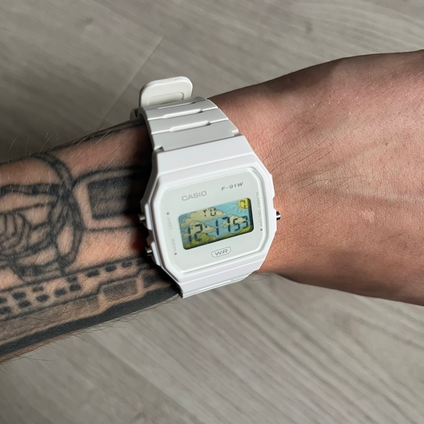 Custom Casio F-91W White digital watch featuring a Landscape filter screen. Slim 8.5 mm profile, lightweight 21 g build and flexible bio-based resin band ensure lasting comfort. Includes alarm, stopwatch, and microlight function for everyday functionality.