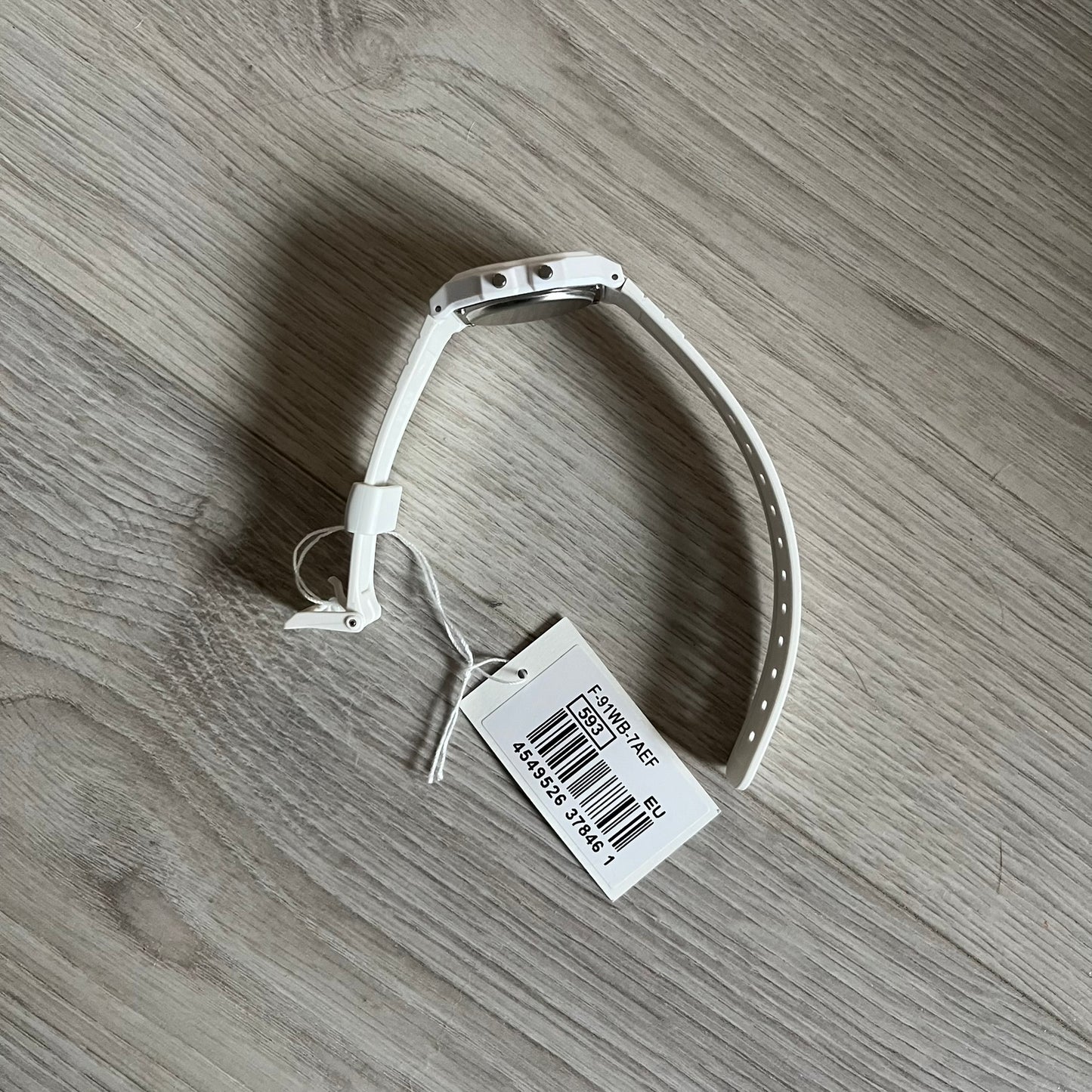 Custom Casio F-91W White digital watch featuring a Trollface meme filter screen. Slim 8.5 mm profile, lightweight 21 g build and flexible bio-based resin band ensure lasting comfort. Includes alarm, stopwatch, and microlight function for everyday functionality.