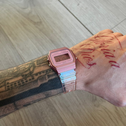 Custom Casio F-91W Pink digital watch featuring a fully Pink filter screen. Slim 8.5 mm profile, lightweight 21 g build and flexible bio-based resin band ensure lasting comfort. Includes alarm, stopwatch, and microlight function for everyday functionality.