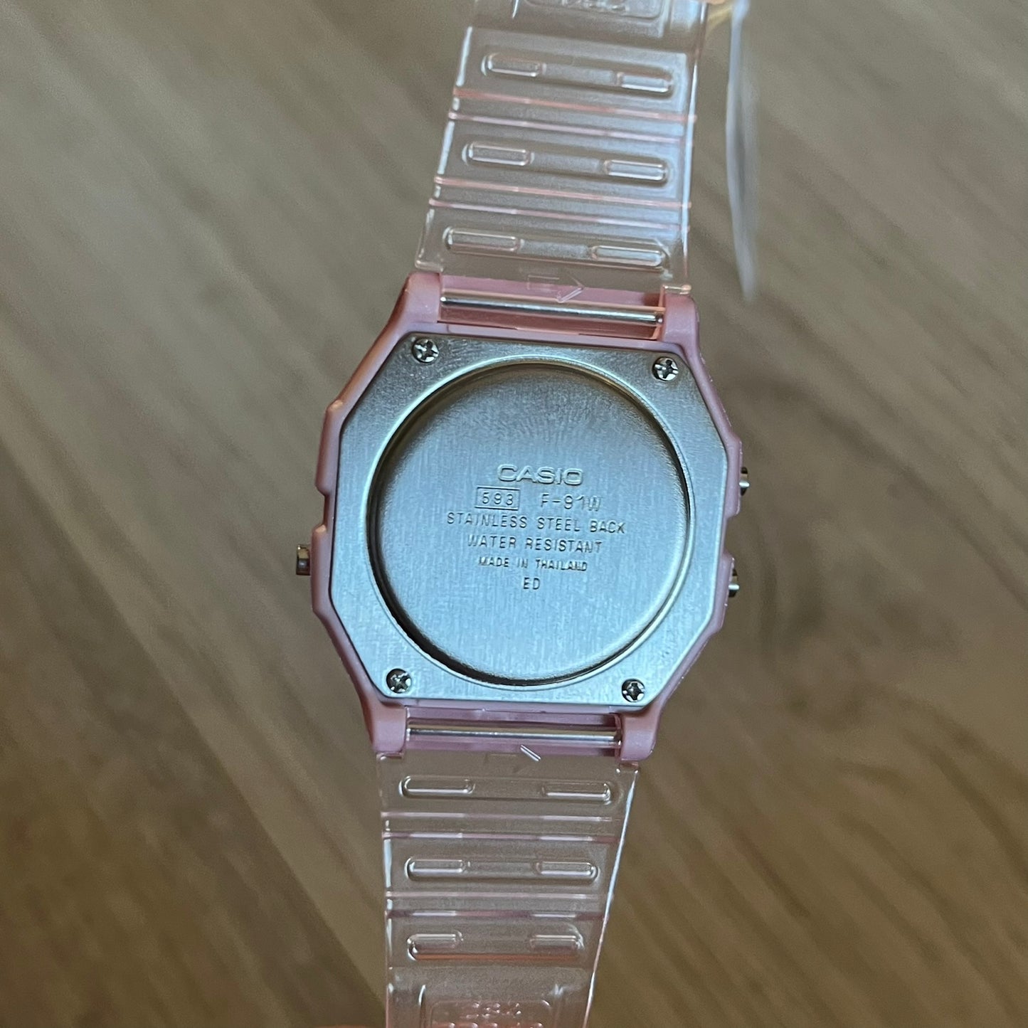 Custom Casio F-91W Pink digital watch featuring a fully Pink filter screen. Slim 8.5 mm profile, lightweight 21 g build and flexible bio-based resin band ensure lasting comfort. Includes alarm, stopwatch, and microlight function for everyday functionality.