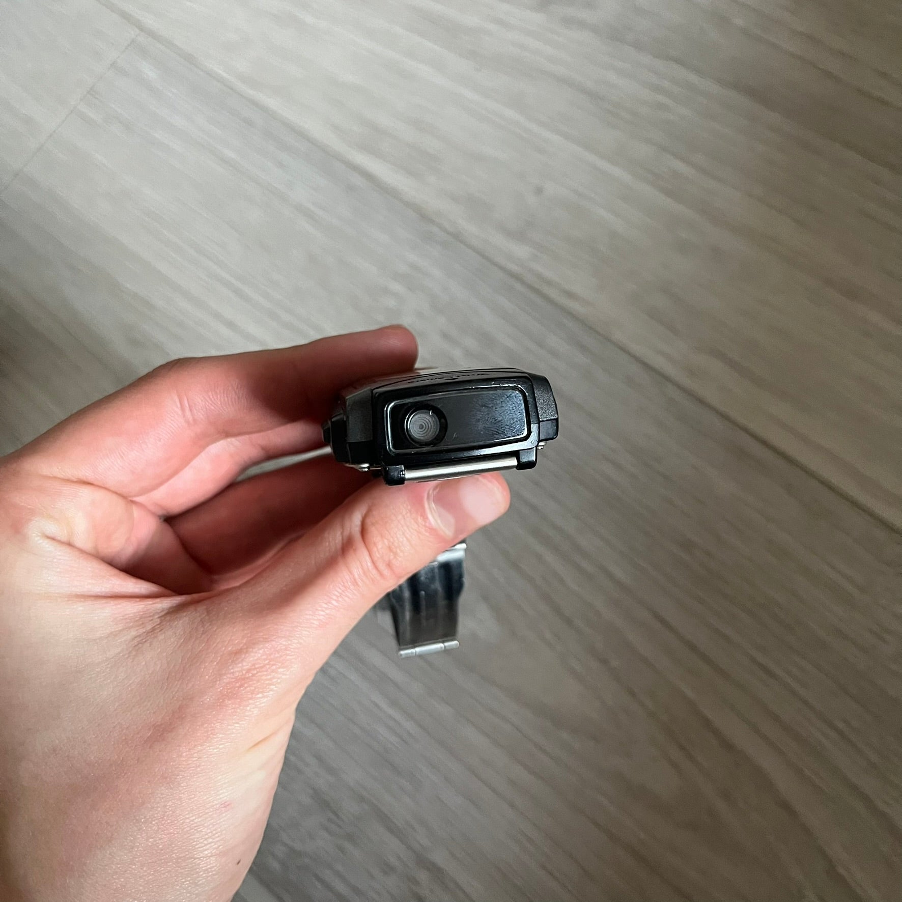 Casio Wrist Camera 2220 WQV-1 Digital Watch from the 2000s, made in Japan. Features a built-in camera module at the top, with six function buttons for photo capture, IR communication, alarm, timer, stopwatch, and gallery viewing. Monochrome photo output in shades of black, white, and gray; fitted with a non-original bracelet.