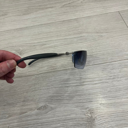 Chanel 4008 Rimless Silver Sunglasses with blue gradient lenses, combining a futuristic rimless design with vintage early 2000s style. Features CC logos on the temples, Chanel engraving on the bridge, and a silver metal frame. Made in Italy with CE certification.
