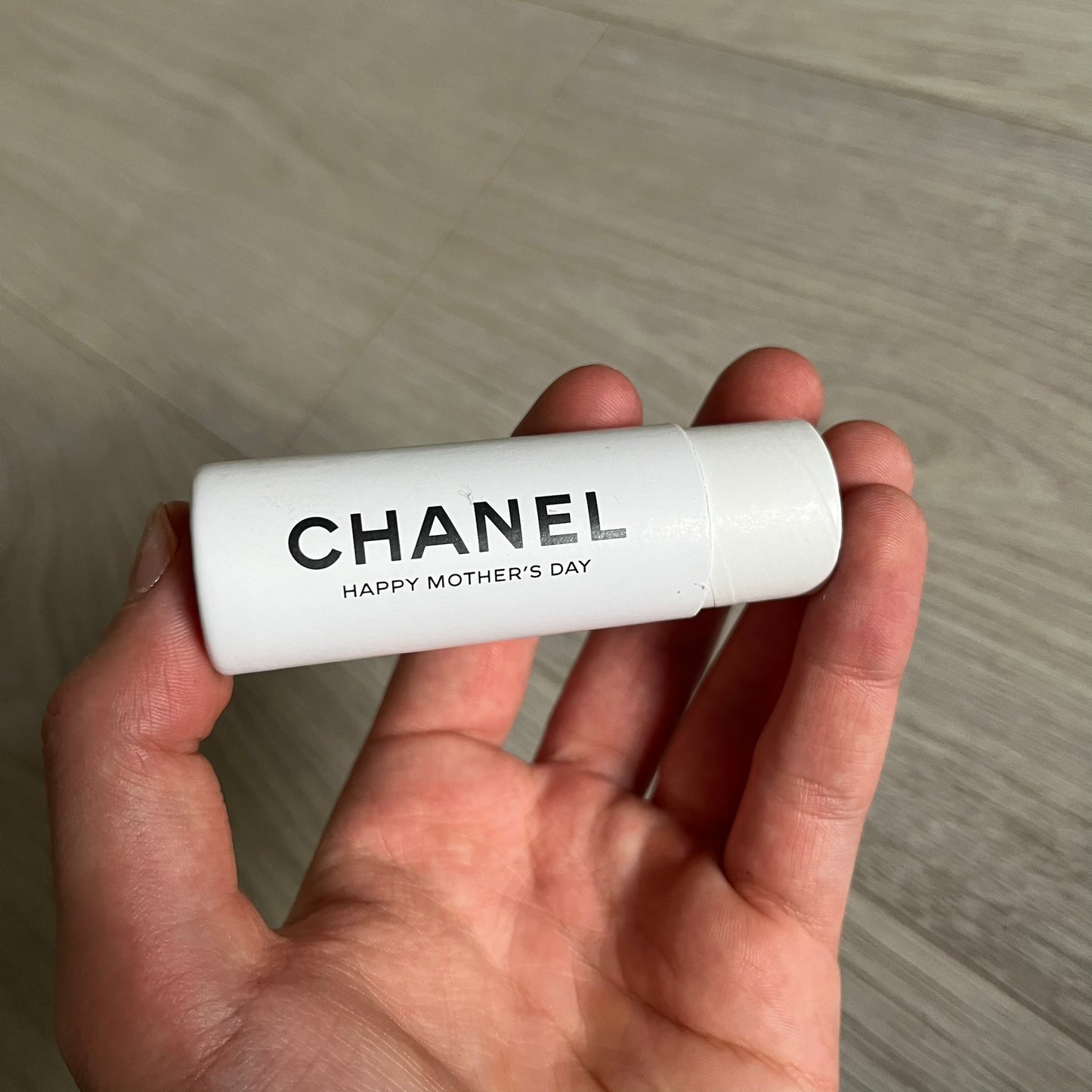 Chanel Mother’s Day Colored Pencils Set from 2021, presented in a white cylindrical tube with “Happy Mother’s Day” text and the Chanel logo on top. A Chanel Beauté complimentary gift featuring six branded colored pencils in blue, red, yellow, brown, orange, and green.