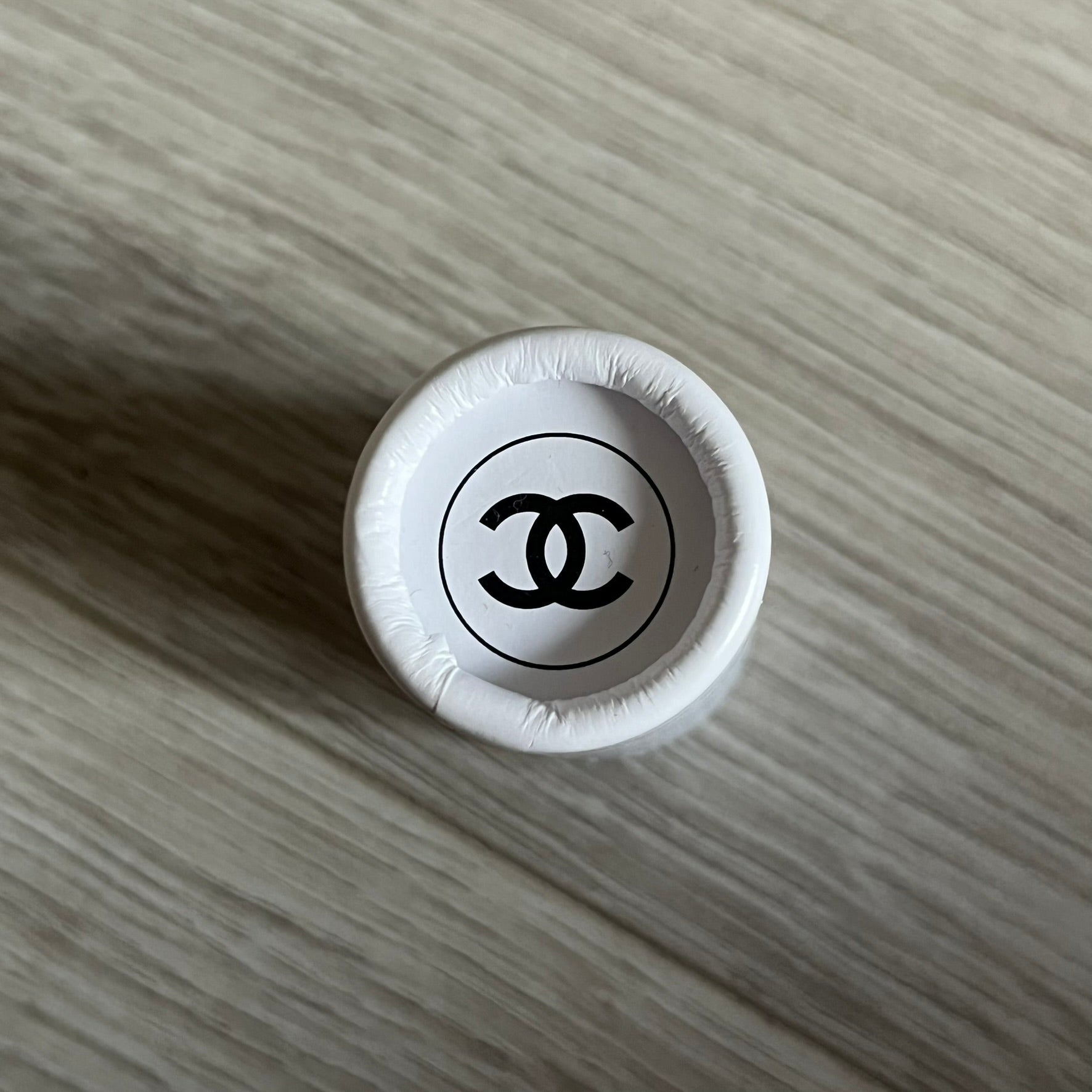 Chanel Mother’s Day Colored Pencils Set from 2021, presented in a white cylindrical tube with “Happy Mother’s Day” text and the Chanel logo on top. A Chanel Beauté complimentary gift featuring six branded colored pencils in blue, red, yellow, brown, orange, and green.