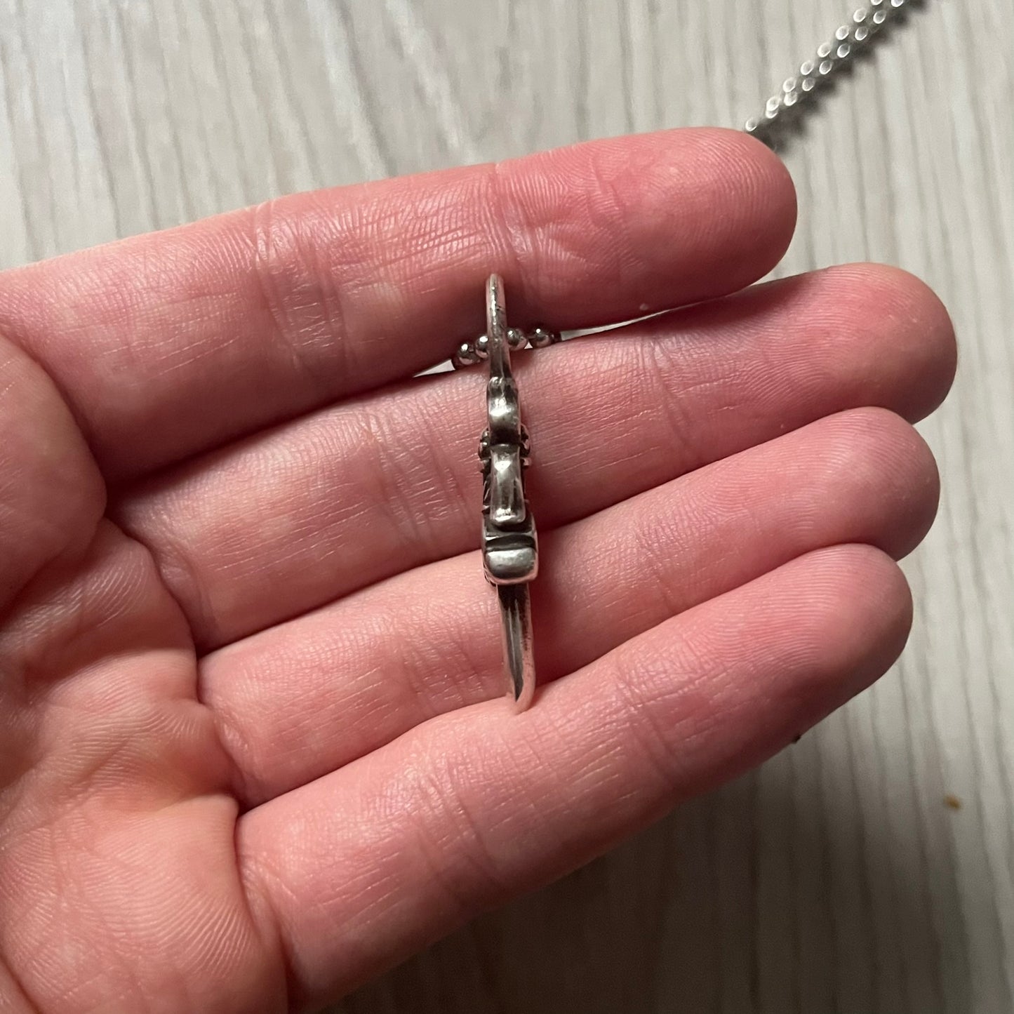 Chrome Hearts Dagger Zipper Pendant crafted from .925 silver, featuring the brand’s signature double-sided dagger design with “Chrome” on the guard and “Hearts” on the blade. Comes on a standard steel ball chain (non-CH). Circular bail for chain attachment. The dagger was originally a zipper pull.