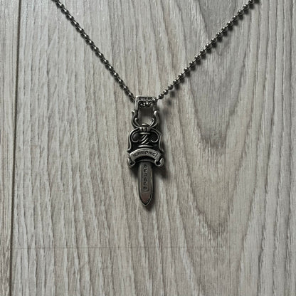 Chrome Hearts Dagger #10 Pendant crafted from genuine .925 silver, featuring the brand’s signature double-sided dagger design with “Chrome” on the guard and “Hearts” on the blade. Comes on a standard steel ball chain (non-CH). The top rectangular bail includes engraved markings: “89/03” on one side and “Sterling” on the other.