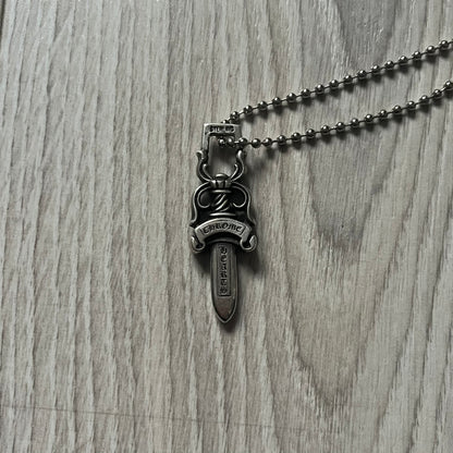 Chrome Hearts Dagger #10 Pendant crafted from genuine .925 silver, featuring the brand’s signature double-sided dagger design with “Chrome” on the guard and “Hearts” on the blade. Comes on a standard steel ball chain (non-CH). The top rectangular bail includes engraved markings: “89/03” on one side and “Sterling” on the other.