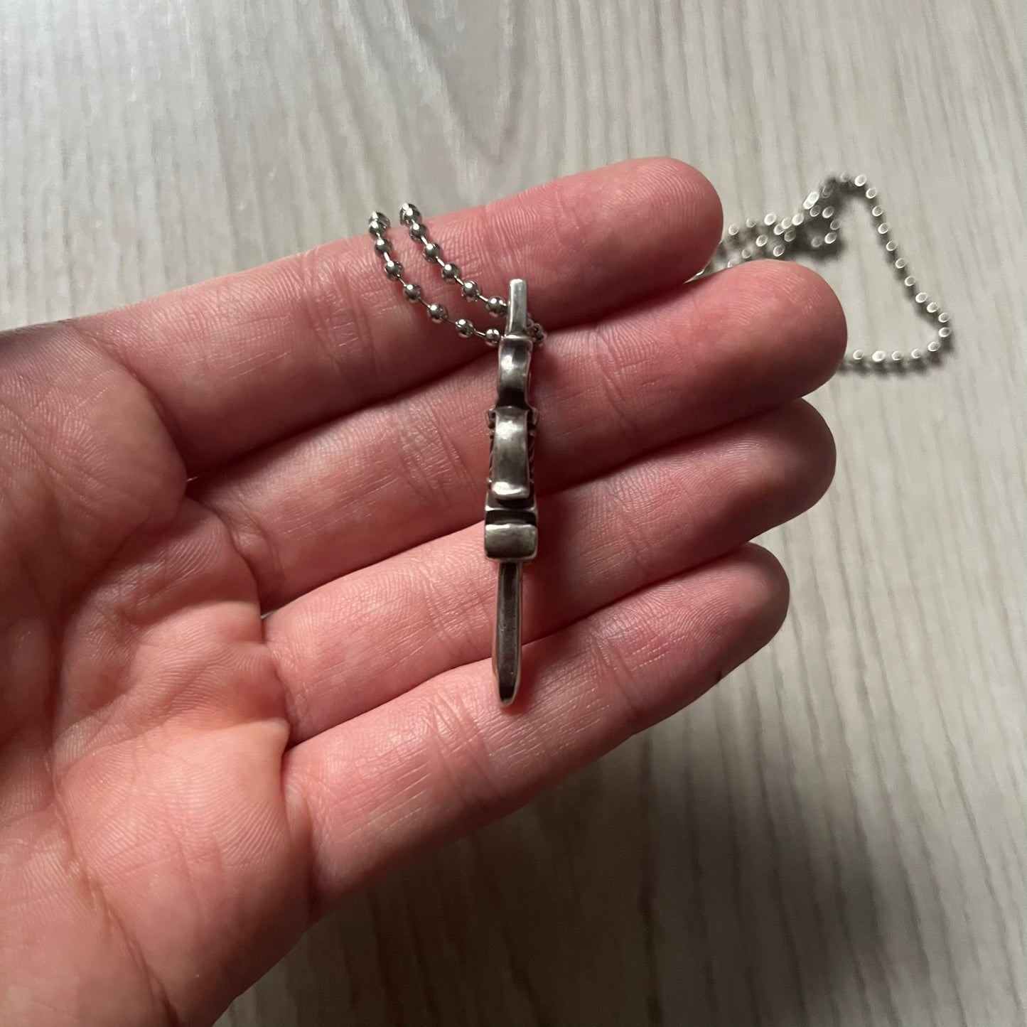 Chrome Hearts Dagger #10 Pendant crafted from genuine .925 silver, featuring the brand’s signature double-sided dagger design with “Chrome” on the guard and “Hearts” on the blade. Comes on a standard steel ball chain (non-CH). The top rectangular bail includes engraved markings: “89/03” on one side and “Sterling” on the other.