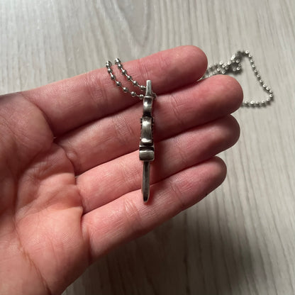 Chrome Hearts Dagger #10 Pendant crafted from genuine .925 silver, featuring the brand’s signature double-sided dagger design with “Chrome” on the guard and “Hearts” on the blade. Comes on a standard steel ball chain (non-CH). The top rectangular bail includes engraved markings: “89/03” on one side and “Sterling” on the other.