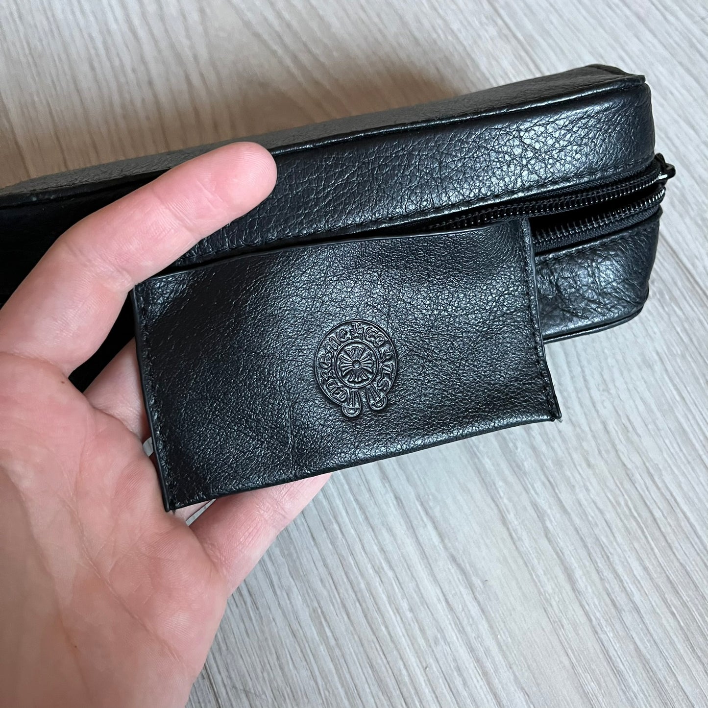 Chrome Hearts Stains Gold Sunglasses featuring a gold-tone metal frame with brown mirror-coated plastic lenses. Made in Japan, this model includes aged silver Chrome Hearts cross detailing wrapped around the arms, cut-out cross accents at the arm tips, and visible Chrome Hearts branding on the bridge and top of the frame. Additional cross branding appears on the nose pads. Comes complete with the original black leather Chrome Hearts zip case, finished with exterior branding and a dagger-shaped zipper pull.