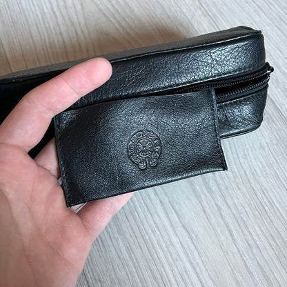 Chrome Hearts Stains Gold Sunglasses featuring a gold-tone metal frame with brown mirror-coated plastic lenses. Made in Japan, this model includes aged silver Chrome Hearts cross detailing wrapped around the arms, cut-out cross accents at the arm tips, and visible Chrome Hearts branding on the bridge and top of the frame. Additional cross branding appears on the nose pads. Comes complete with the original black leather Chrome Hearts zip case, finished with exterior branding and a dagger-shaped zipper pull.