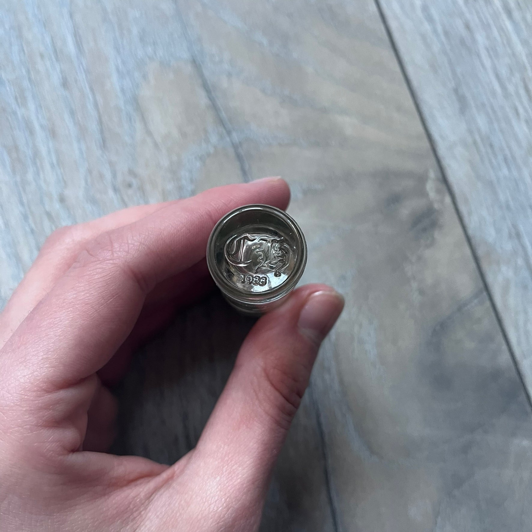 Chrome Hearts +22+ Roll-On Perfume features an aromatic oil blend with prominent jasmine and bergamot notes, designed as a concentrated roll-on fragrance. It is housed in a crystal bottle with a rhodium-plated sterling silver closure, hand crafted in France. The silver cap is detailed with raised Chrome Hearts crosses throughout, a larger cross on top, and embossed Chrome Hearts text wrapping around the base of the closure.