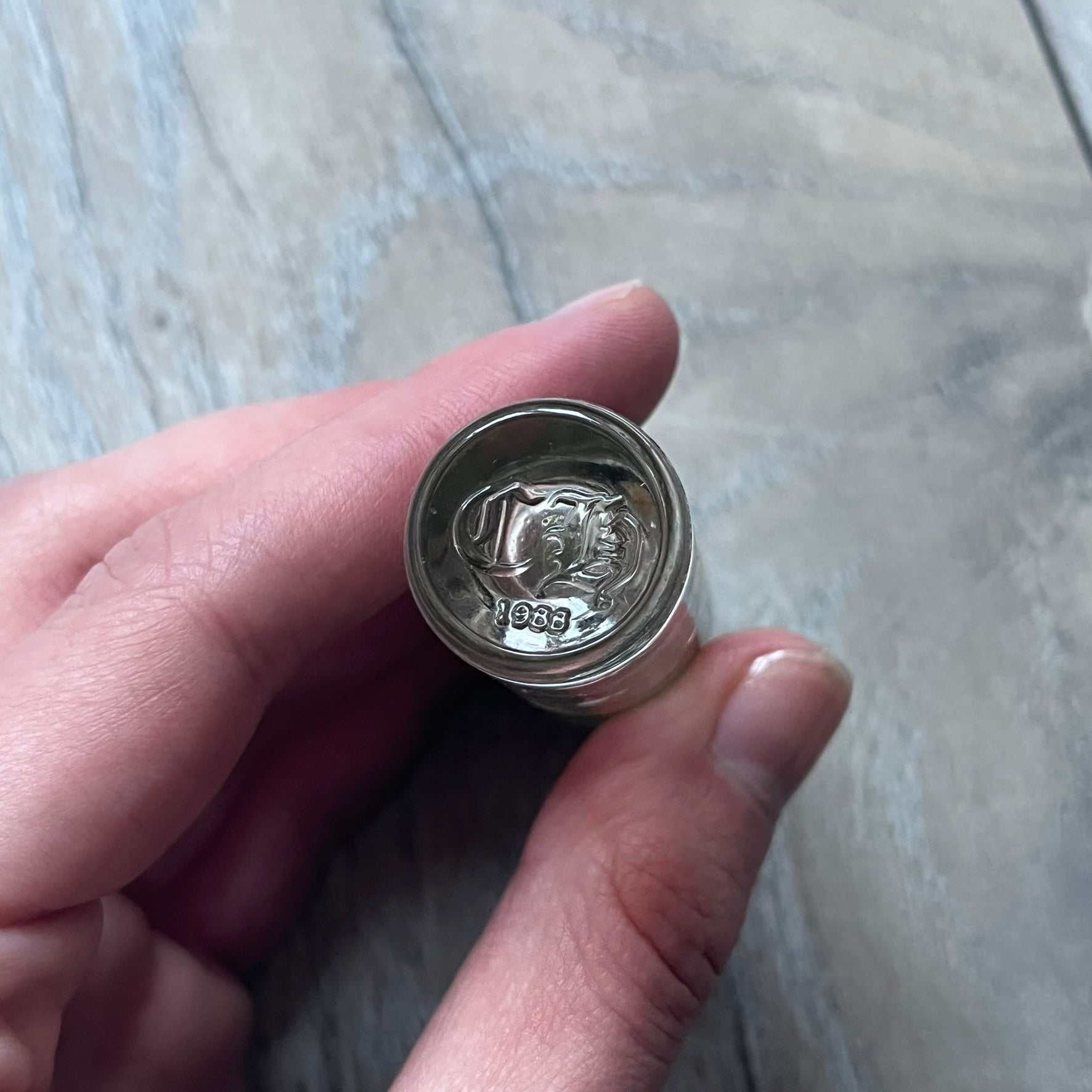 Chrome Hearts +22+ Roll-On Perfume features an aromatic oil blend with prominent jasmine and bergamot notes, designed as a concentrated roll-on fragrance. It is housed in a crystal bottle with a rhodium-plated sterling silver closure, hand crafted in France. The silver cap is detailed with raised Chrome Hearts crosses throughout, a larger cross on top, and embossed Chrome Hearts text wrapping around the base of the closure.