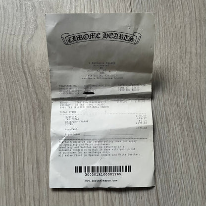 The Chrome Hearts 'Silichrome' Cross Purple Necklace showcases a silicone cross pendant with embossed CH lettering, twin cross graphics on the back, and a 2019 anniversary mark. Offered only through CH flagship stores, it comes paired with a purple ball chain and includes both the dustbag and paper receipt.