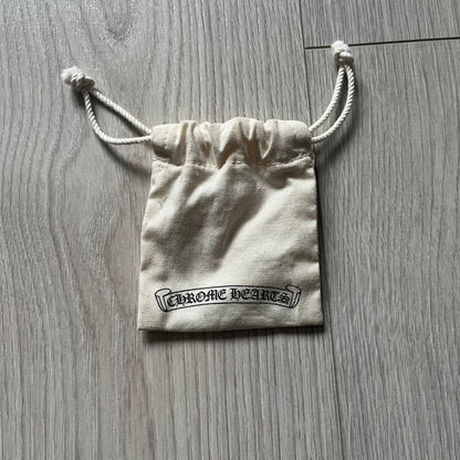 The Chrome Hearts 'Silichrome' Cross Purple Necklace showcases a silicone cross pendant with embossed CH lettering, twin cross graphics on the back, and a 2019 anniversary mark. Offered only through CH flagship stores, it comes paired with a purple ball chain and includes both the dustbag and paper receipt.