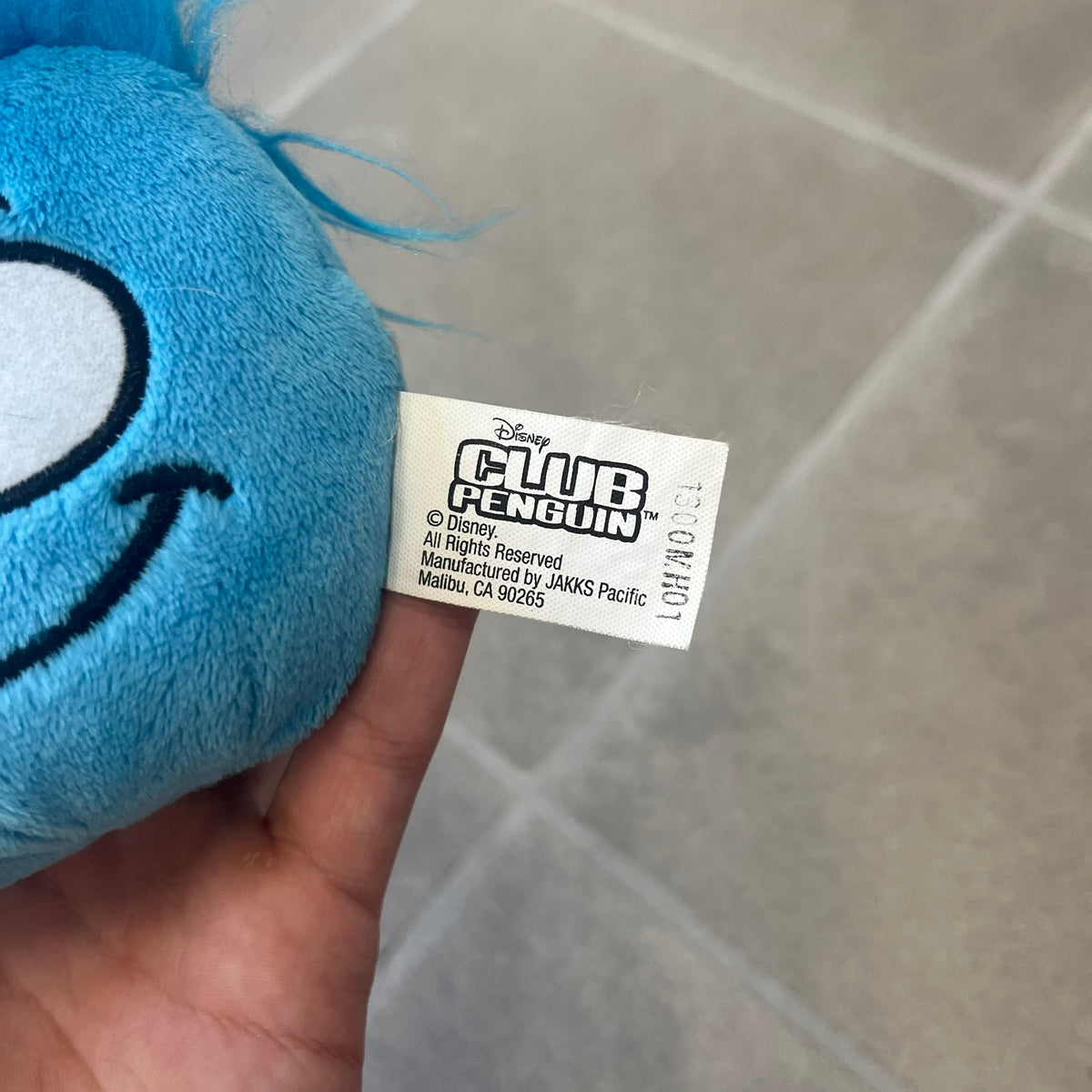 Club Penguin Series 2 Blue Puffle Plushie was Released in 2009 by Disney and Jakks Pacific, featuring a smirking embroidered face, troll-like hair and a half plush half beanie body. It comes with a Disney-licensed tag.