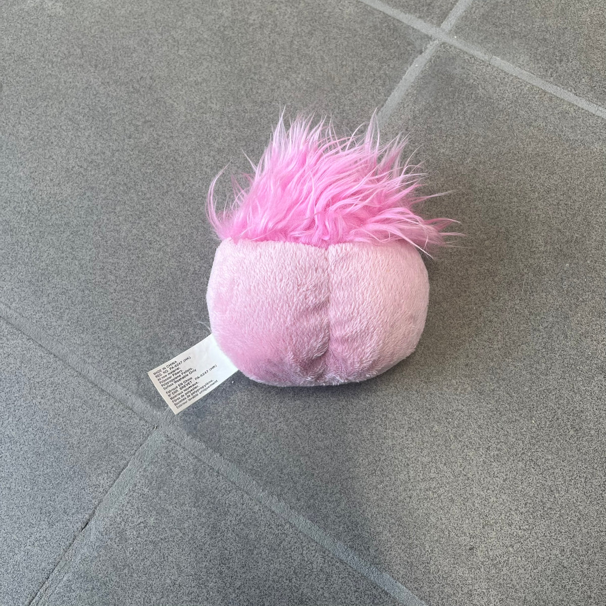 Club Penguin Series 2 Pink Puffle Plushie was Released in 2009 by Disney and Jakks Pacific, featuring an embroidered happy face with a tongue out, troll-like hair and a half plush half beanie body. It comes with a Disney-licensed tag.