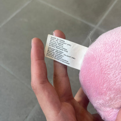 Club Penguin Series 2 Pink Puffle Plushie was Released in 2009 by Disney and Jakks Pacific, featuring an embroidered happy face with a tongue out, troll-like hair and a half plush half beanie body. It comes with a Disney-licensed tag.