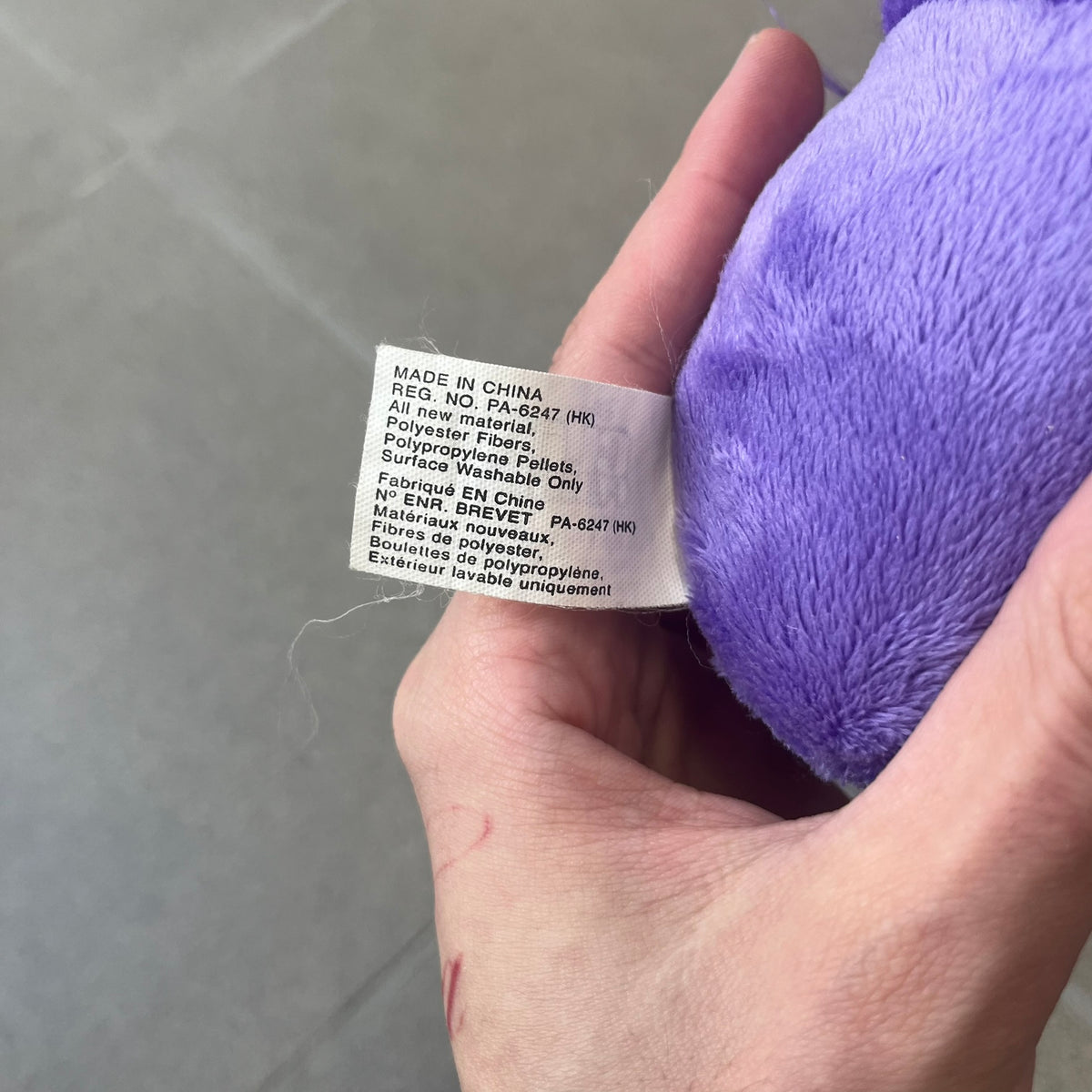 Club Penguin Series 2 Purple Puffle Plushie was Released in 2009 by Disney and Jakks Pacific, featuring a smirking looking up embroidered face, troll-like hair and a half plush half beanie body. It comes with a Disney-licensed tag.