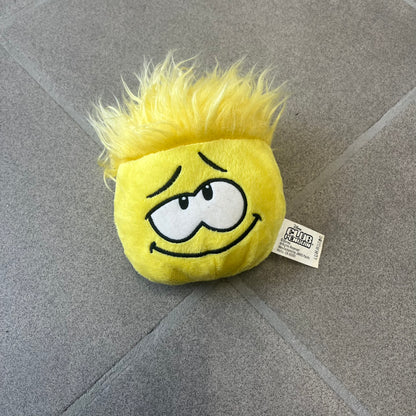 Club Penguin Series 2 Yellow Puffle Plushie was Released in 2009 by Disney and Jakks Pacific, featuring a looking up embroidered face, troll-like hair and a half plush half beanie body. It comes with a Disney-licensed tag.