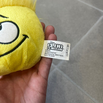 Club Penguin Series 2 Yellow Puffle Plushie was Released in 2009 by Disney and Jakks Pacific, featuring a looking up embroidered face, troll-like hair and a half plush half beanie body. It comes with a Disney-licensed tag.