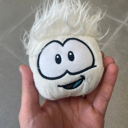 Club Penguin Series 3 White Puffle Plushie was Released in 2009 by Disney and Jakks Pacific, featuring a happy embroidered face, troll-like hair and a half plush half beanie body. It comes with a Disney-licensed tag.