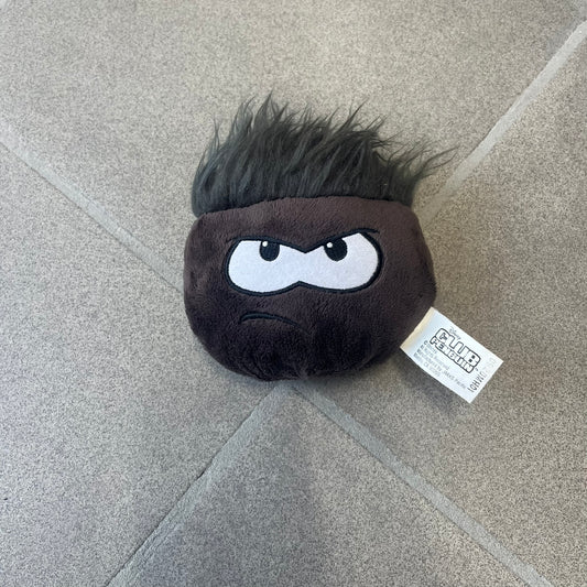 Club Penguin Series 4 Black Puffle Plushie was Released in 2009 by Disney and Jakks Pacific, featuring an angry embroidered face, troll-like hair and a half plush half beanie body. It comes with a Disney-licensed tag.