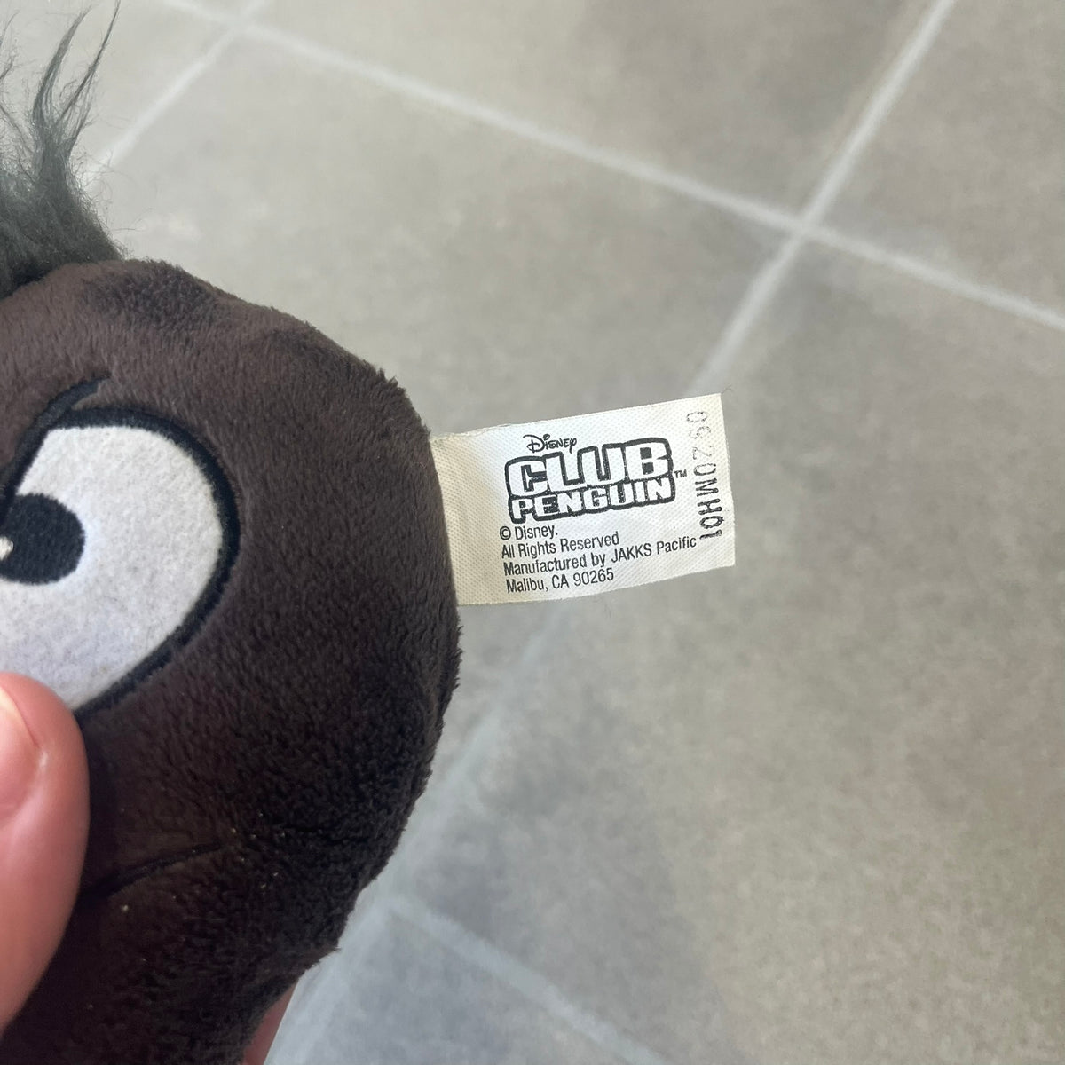 Club Penguin Series 4 Black Puffle Plushie was Released in 2009 by Disney and Jakks Pacific, featuring an angry embroidered face, troll-like hair and a half plush half beanie body. It comes with a Disney-licensed tag.